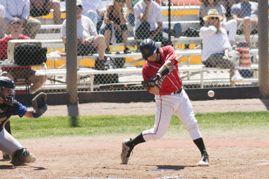 Vaqueros catcher Alonzo Rubalcaba (No. 15) rips an RBI single into right center field to cap off a seven run second inning on Saturday, April 13, 2019, at Pershing Park in Santa Barbara, Calif. The Vaqueros won the game 11-9.