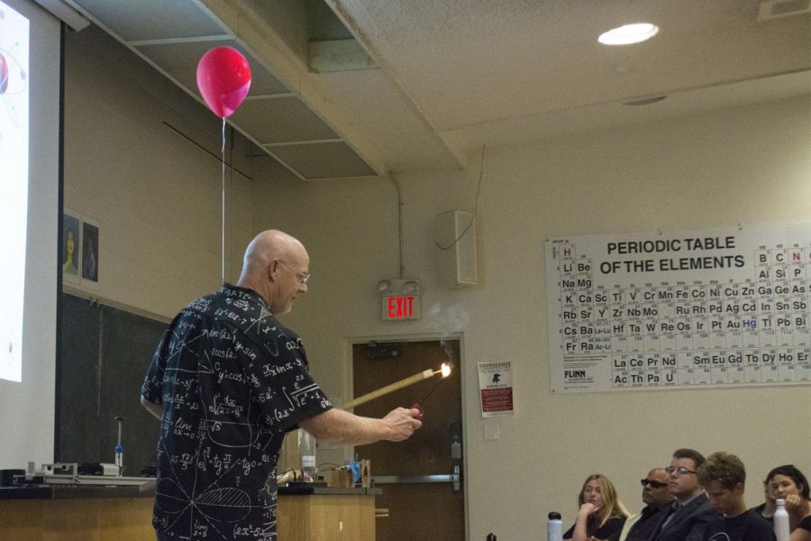 Doctor Michael Young demonstrates how a Hydrogen bomb works with a balloon and how the chemical reacts to heat in the Futurism Club on Thursday, April 18, 2019, in the Physical Sciences Building Room 101 at City College in Santa Barbara, Calif.