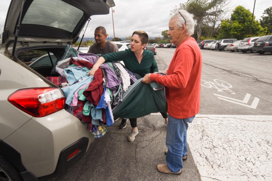 From left, Rafael Castro and Raeanne Napoleon help Larry Friesen unload his donation of 110 shirts to Tiffany’s Closet on Friday, April 5, 2019, in front of the donation drop off Room ECC 6 at City College in Santa Barbara, Calif. Castro stepped in to help unload the shirts and Napoleon organized the donations.