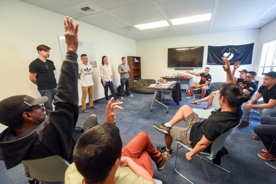 At the front of the room in the black t-shirt, Christian Wicklein is elected as the Veterans Club vice president, Megan Lee in the white blouse, is elected club present and Ramiro Detrinidad in the grey t-shirt, is elected club treasurer in The Well on Friday, April 19, 2019, at City College in Santa Barbara, Calif.