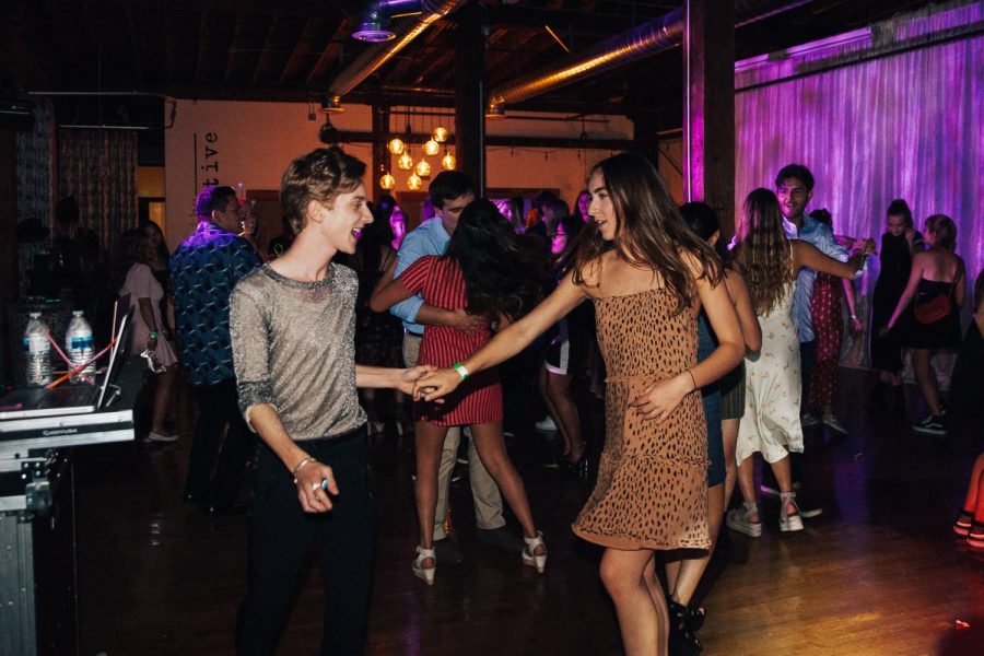 Sunny De’Vries Paulson dances and laughs with Haley Kittleson during the American Prom for International Students on Thursday, April 25, 2019, at The Narrative Loft in Santa Barbara, Calif.