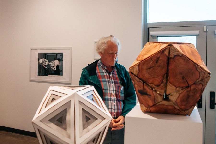 Karl Blasius observes a sculpture during the Annual Student Exhibition on Friday, April 12, 2019, in the Atkinson Gallery at City College in Santa Barbara, Calif. Blasius, a phycology major at SBCC, used to be an art major and once had his work featured in the Atkinson Gallery 12 years back.