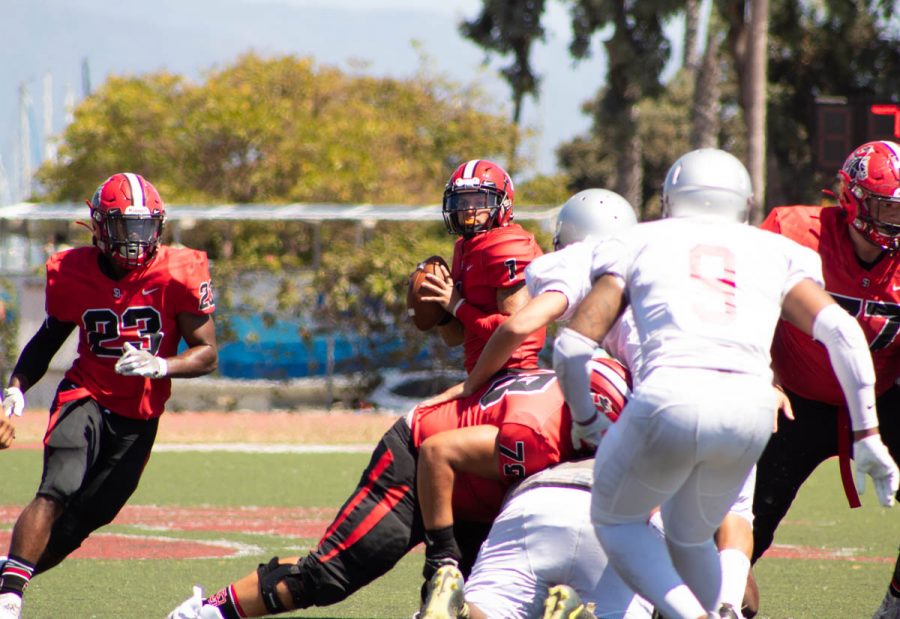 Vaqueros Quaterback Scotty Forbes looks down field for an open pass to Trey Hunter (No.23) on Friday, Sept. 7 at La Playa Stadium at City College in Santa Barbara, Calif. The Vaqueros went on to beat the Tartars 57-6.