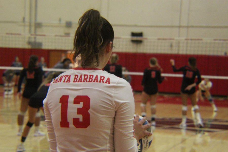 Bella Brandt stands in position to serve the ball during a match against the Canyons on Wednesday, Sept. 11 2019, in the Sports Pavilion at City College in Santa Barbara, Calif. The Vaqueros beat the Canyons 3-1.