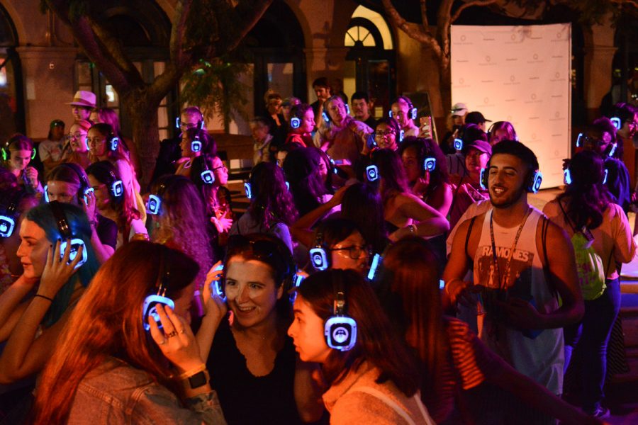 SBCC and UCSB students dance and socialize at the silent disco during College Night Out at Paseo Nuevo Mall on Tuesday, Sept. 24, 2019, in Santa Barbara, Calif. Dozens of students gathered to mingle, win prizes and hang out during the 3 hour event put on by City College.