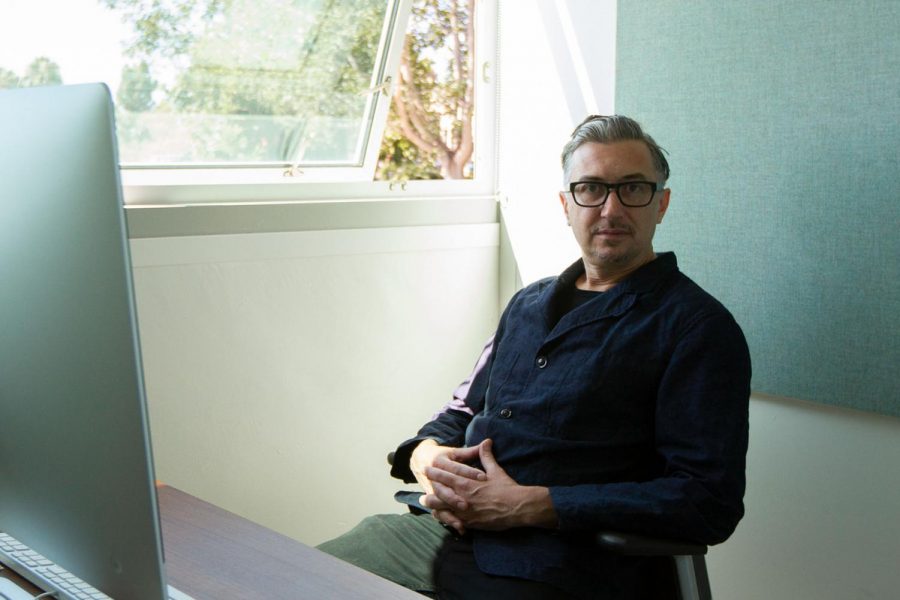 John Connelly sits in his office as the new Director of The Atkinson Gallery on Wednesday, Sept. 11 2019, in the Humanities Building at City College in Santa Barbara, Calif.