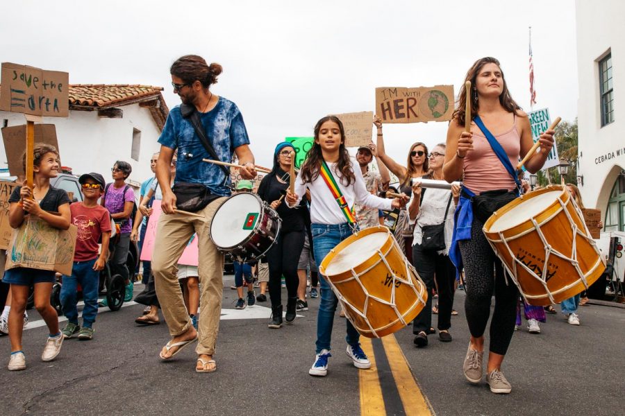 From left, drummers Marceu Lima, Manoela Figuer and Sofia Smith Hale lead the climate strike march towards State Street from De La Guerra Plaza on Friday, Sept. 27, 2019, in Downtown Santa Barbara, Calif. Lima started the Osé-Afro Brazialin Drumming Group 1 year ago and believes drums help people stay motivated in a march and create a strong energy.