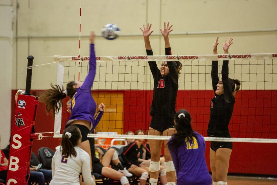 Vaqueros players Gabi Brewer (No.10) and Jordan Falconer (No.6) leap over the net to defend the opponents strike on Tuesday, Oct. 2, 2019, in the Sports Pavilion at City College in Santa Barbara Calif. The Vaqueros beat Cal Lutheran JV 3-0.