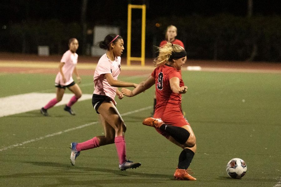 Molly Branigan (No9) getting the ball away from Kayla Acosta (No4) on Thursday, Oct. 17, 2019, at La Playa Stadium at City College in Santa Barbara, Calif. The Vaqueros beat La Pierce college 2-0.