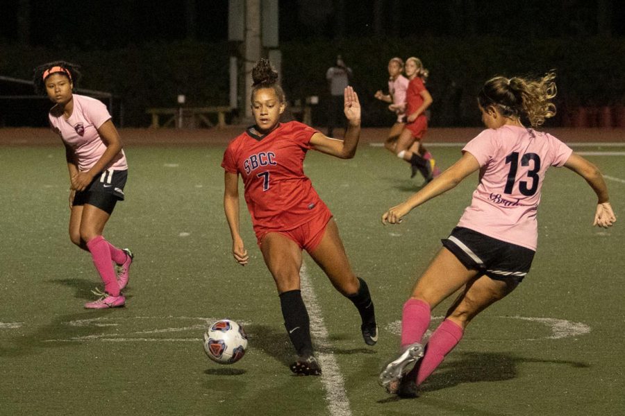 Mekaylla White (No7) maneuvering her way past Amelia Weckhurst (No13) on Thursday, Oct. 17, 2019, at La Playa Stadium at City College in Santa Barbara, Calif. After two last minute goals the Vaqueros beat La Pierce 2-0.
