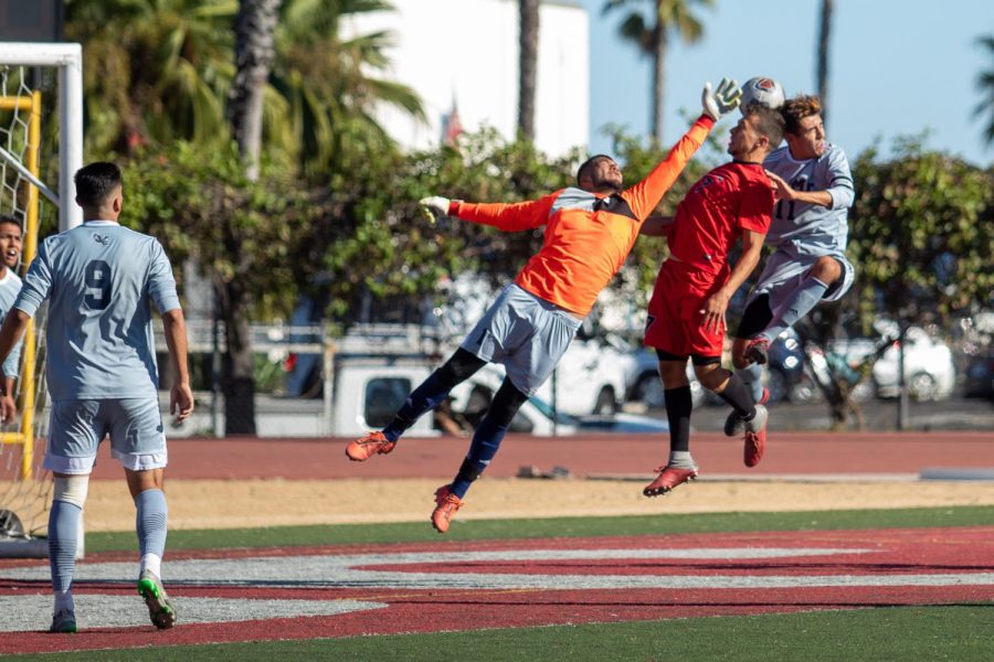 Wayne MCclellan (No.7) tries to shoot into the goal but multiple defenders contest him on Friday, Oct. 25, 2019, at La Playa Stadium at City College in Santa Barbara, Calif.