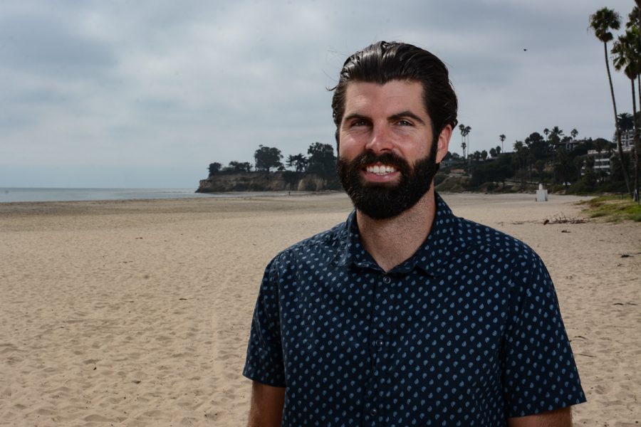 Former city college student Oliver Aquilon stands on the beach where he gets his inspiration for his art on Wednesday, Oct. 9, 2019, on Leadbetter Beach in Santa Barbara, Calif. Aquilon is a painter and also makes sculptures out of driftwood in his garage here in Santa Barbara, Calif.