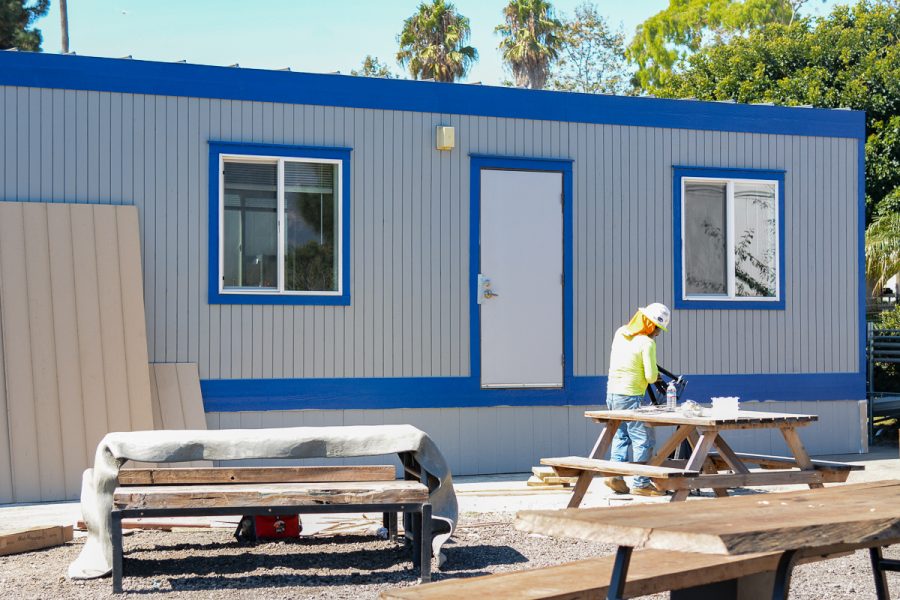 Workers finalized the new City College Food Pantry building by caulking and sealing the outside to ensure durability on Monday, Oct. 7, 2019, on East Campus at City College in Santa Barbara, Calif. 