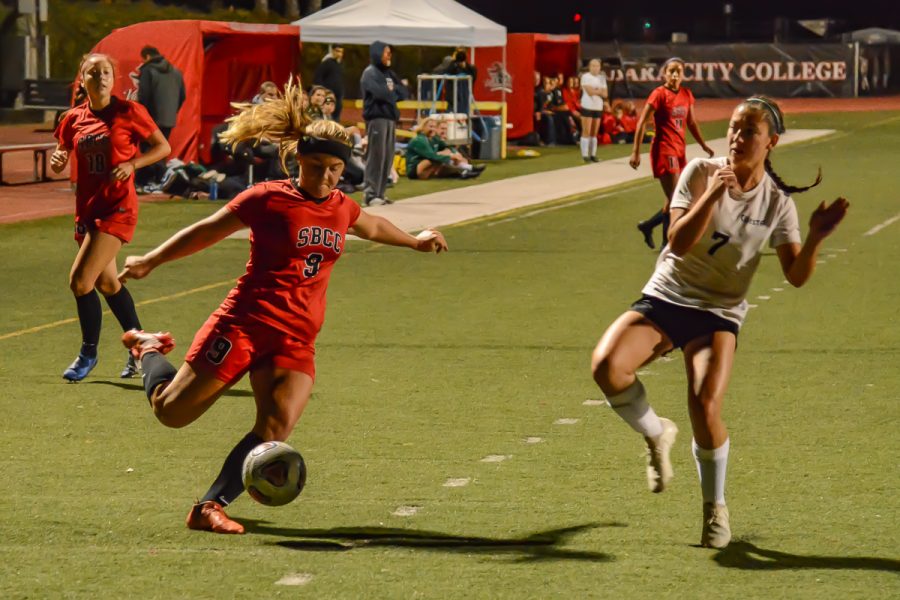 Midfielder Molly Branigan (No. 9) crosses the ball past defender Alley Andrade (No. 7) to her teammates near the goal during the Vaqueros game against the Cuesta Cougars on Tuesday, Oct. 29, 2019, at La Playa Stadium at City College in Santa Barbara, Calif. The Vaqueros won the game 4-1 from Branigan’s goal and a hat trick from teammate Mekaylla White.