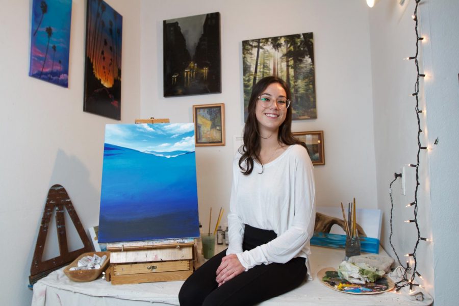 Artist and marine biology major Havilah Abrego sits in her private home art studio on Thursday evening, Oct. 17, 2019, in Ventura, Calif. Abrego has developed her artistic passion through the inspiration of her father and grandfather's artwork.