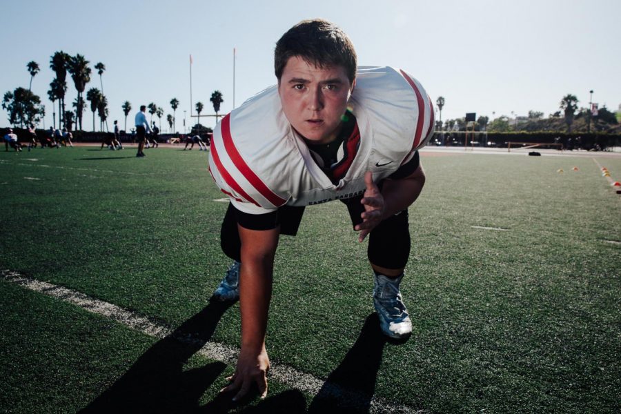 Vaqueros offensive lineman Brenden Chapman holds a ready stance on La Playa Field just before practice on Monday, Sept. 30, 2019, at City College in Santa Barbara, Calif. Chapman or “Chappy” as his teammates call him, is a stage-four colon cancer survivor and sets an example of toughness and resilience that head coach Craig Moropoulos believes the other players can learn from.