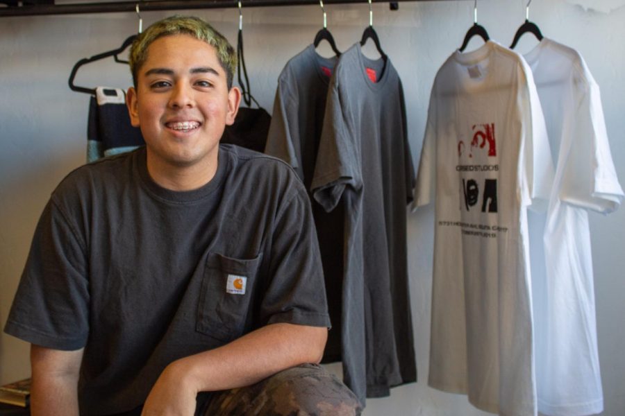 Angelo Falcon posted up with his merchandise from Cursed Studios his own clothing line inspired by the horror movie genre, on Saturday Oct. 26, 2019, at the 805 Store, Goleta, Calif. Falcon is a former Santa Barbara City College student, and has been on his way up with his clothing brand.