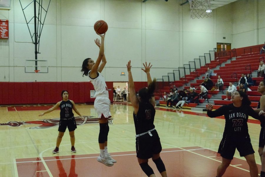 Sophia Torres (No.12) goes for a jump shot past San Diego City College defender Jazmine Lee (No.13) during the Vaqueros game in the Sports Pavilion Gym on Thursday, Nov. 7, 2019 at City College in Santa Barbara, Calif. 
