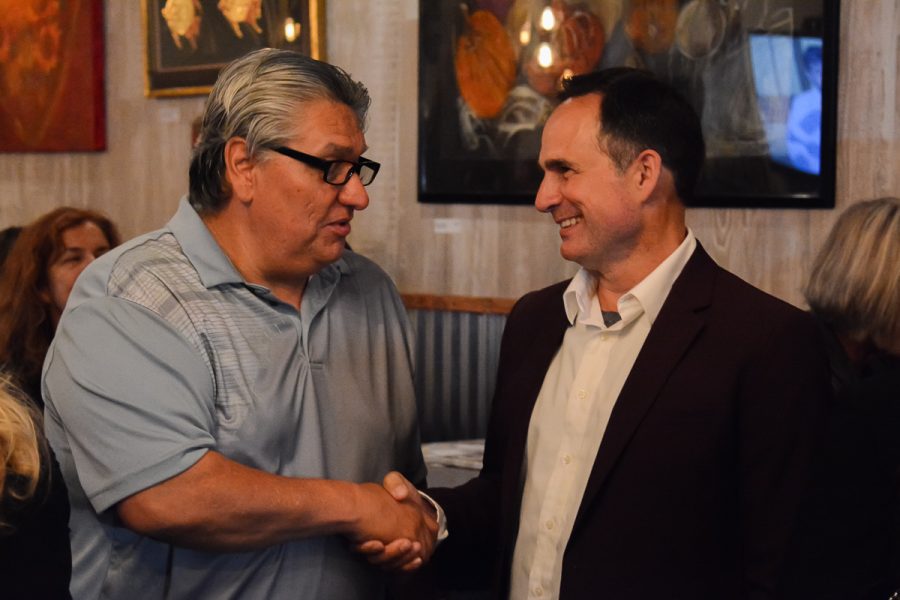 District 1 City Council Candidate Jason Dominguez (right) shaking hands with a campaign supporter after receiving results for the election on Tuesday, Nov. 5, 2019. Dominguez held a party at Uncorked Wine Tasting and Kitchen in downtown Santa Barbara, Calif.