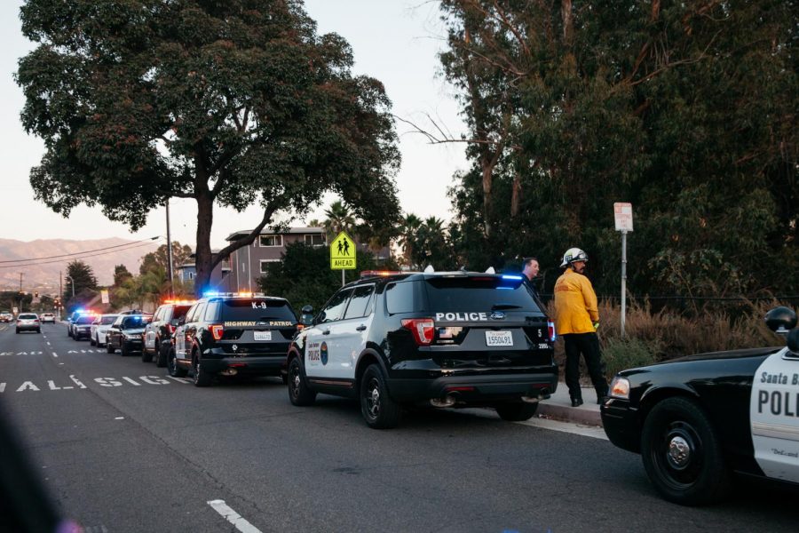 Police gather on Cliff Drive near Beach City in response to the armed shooter alert near City College on Wednesday, Oct. 30, 2019, in Santa Barbara, Calif. The suspect was unarmed and fled police due to a parole violation.