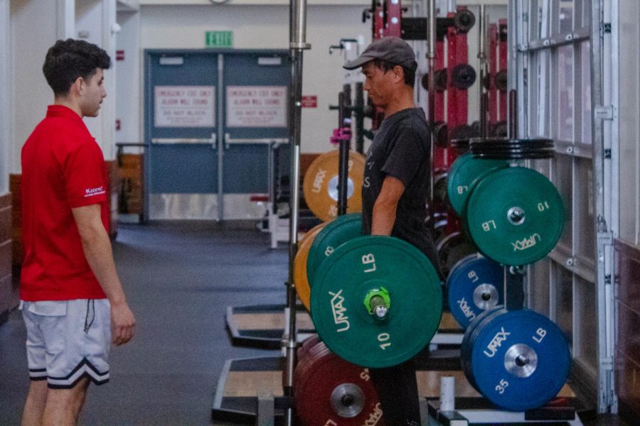 Joan Gao works on deadlift Position and stance under direction of Andrew Arnopole on Friday, Dec. 6, 2019, in the Life Fitness Center at City College in Santa Barbara, Calif.