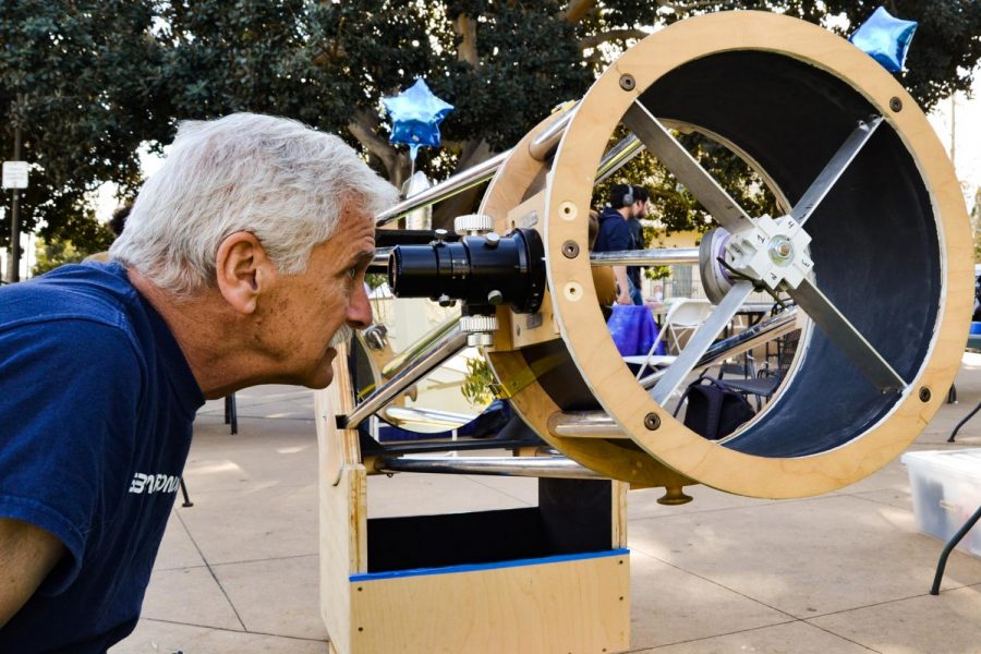 Former student and astronomy enthusiast Bob Smith looks at the Santa Ynez mountains behind Santa Barbara through the telescope the Astronomy Club built on Wednesday, Jan. 29, at the Friendship Plaza on East Campus at City College in Santa Barbara, Calif.