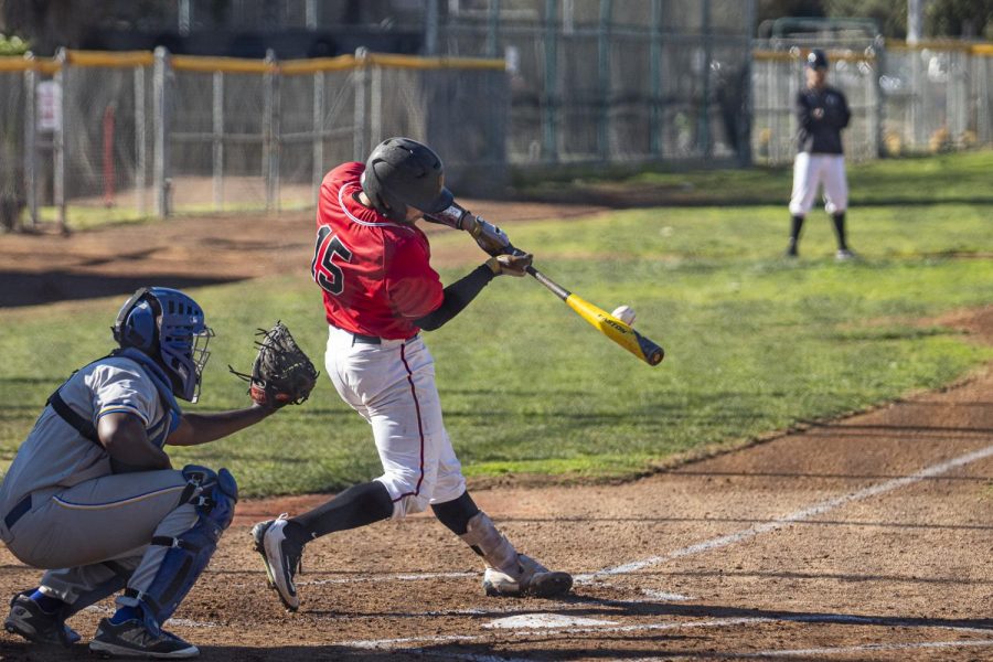 Alonzo Rubalcaba (No.15) hits the ball down the middle and gets a single, on Saturday, Jan. 25, 2020, at Pershing Park, City College in Santa Barbara, Calif. City College beat West LA Community College 4-3.