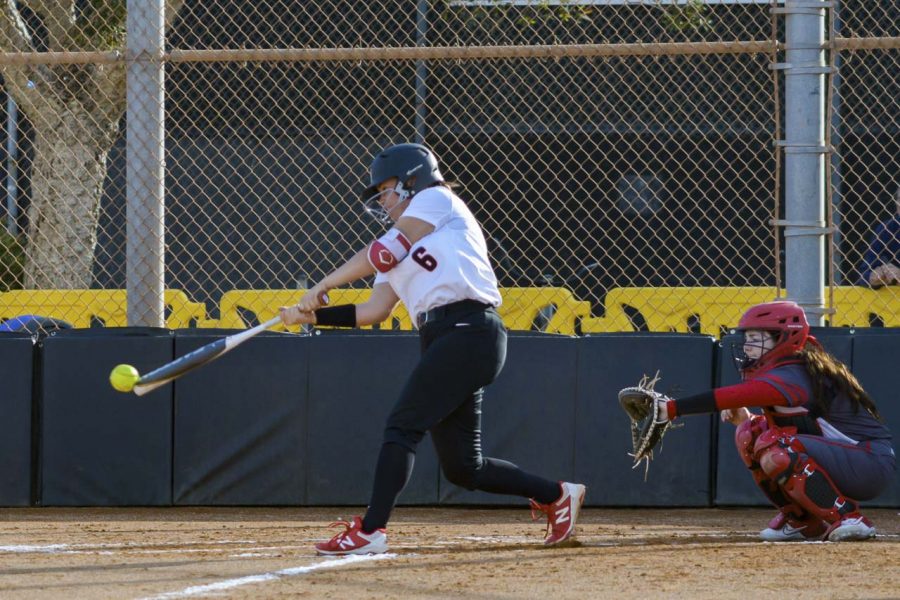 Paige Powell drives a ball down the right-field line during the third inning of the Vaqueros game against the Bakersfield College Renegades on Thursday, Jan. 30, at Pershing Park in Santa Barbara, Calif. The Vaqueros lost the game 13-5.