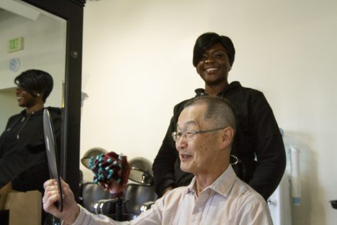 Kaz Mayeda admires his new hair cut done by student Abi O. on Feb. 5, 2020, at the City College Cosmetology Academy in Downtown Santa Barbara, Calif. Kaz said he only gets his hair cut at the academy and enjoys his appointments for the friendly and attentive service.