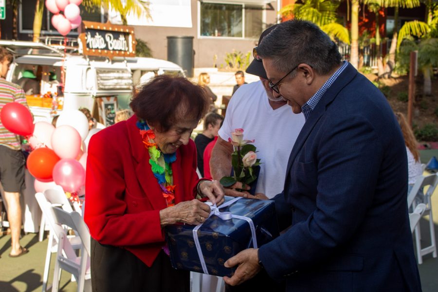 Rep. Salud Carbajal, D-Santa Barbara, along with Beach City's owner Ed. St. George presents Jean Nell with a birthday gift at Nell's Birthday party on Fri. Feb. 14 2020 at Beach City in Santa Barbara, Calif.