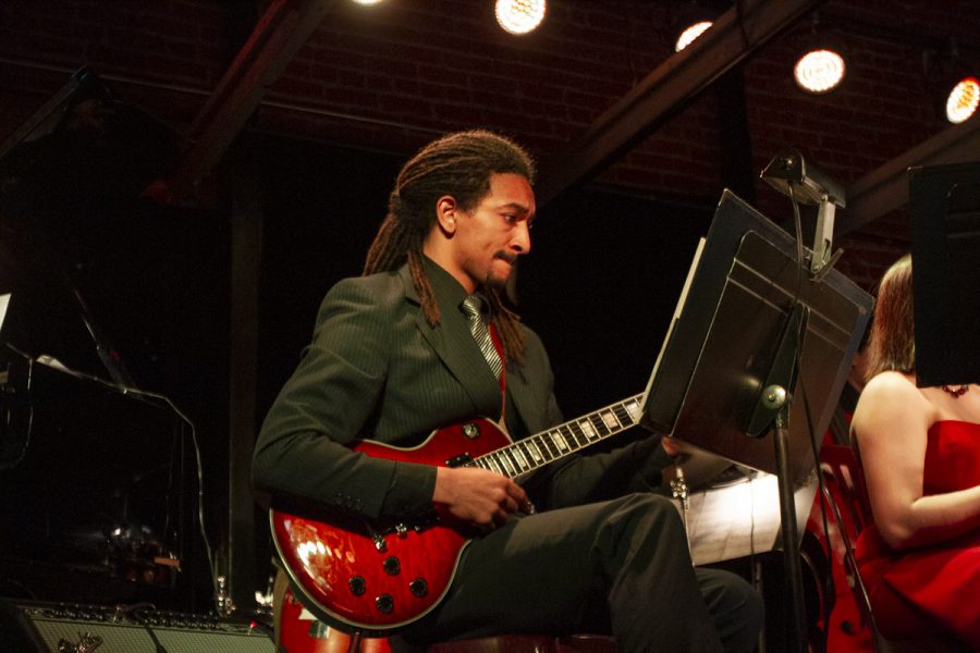 Brandon Kinalele plays the guitar during the first Jazz Ensemble Concert of the season on Monday, Feb. 10, 2020, at the SOhO Restaurant and Music Club in Santa Barbara, Calif.