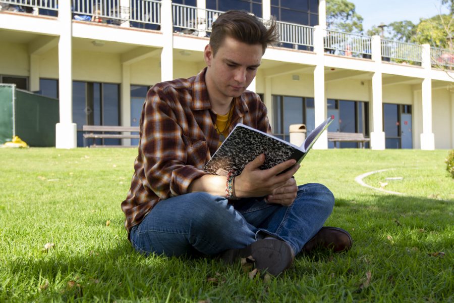 Jeremy Siegel Steffen writes poetry in a grassy patch next to the ECC building on Feb. 5, 2020, at City College in Santa Barbara, Calif. Steffen writes poems here during his free time between classes or working at The Well.