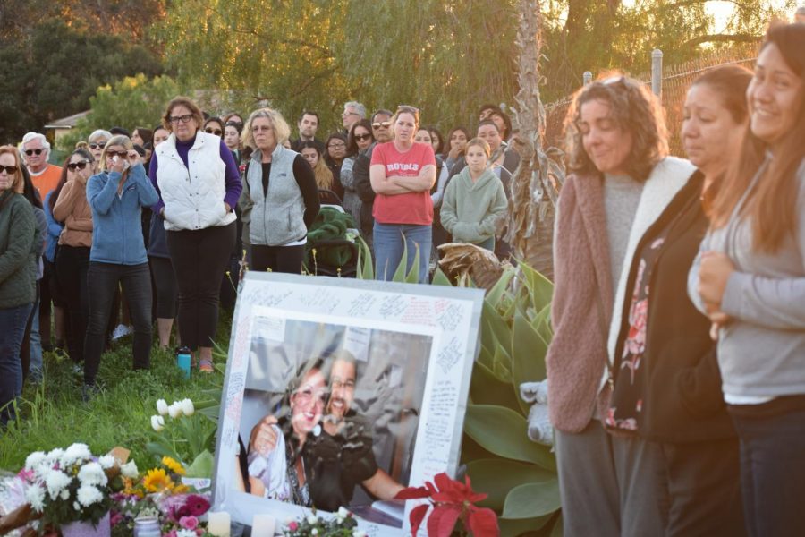 Friends, family and community members share memories and prayers at a memorial for Mary-Jane and Adolfo Corral on Cathedral Oaks Road on Monday, Feb. 10 in Goleta, Calif.