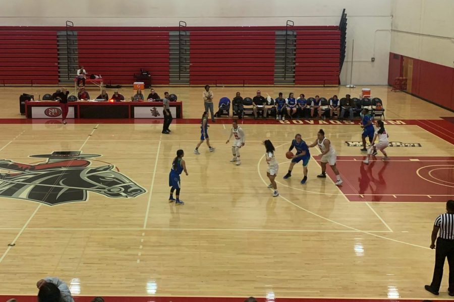 City College players defend the Oxnard offense in the third quarter of their game against the Condors on Saturday, Feb. 15, in the Sports Pavilion at City College in Santa Barbara, Calif. The Vaqueros narrowly beat Oxnard 70-69.