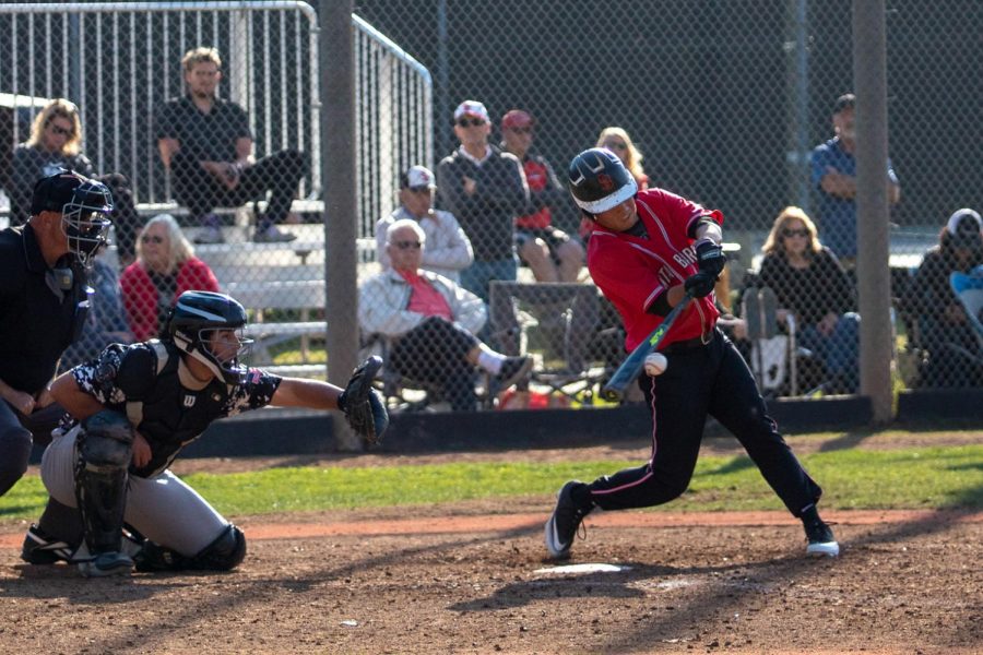 Kyle Froemke (No.8) lands a solid hit that results in a single on Saturday, Feb. 8, 2020, at Pershing Park at City College in Santa Barbara, Calif. The Vaqueros lost to the Knights 4-1.