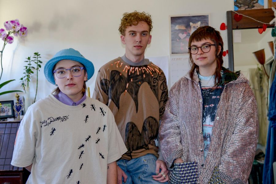 From left, Bailey Holland, Will Goodnough and Ray Kutcher wear a few of the articles of clothing they made for their art collective brand called Swampwater.