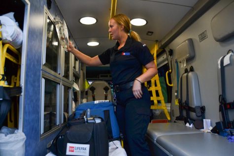 Tia Taylor checks emergency equipment in an ambulance before her night shift on Thursday, March, 12, 2020, at the American Medical Response Station in Goleta, Calif. "We will be expecting a lot of calls regarding the Coronavirus,” Taylor said. “Making sure we are prepared is crucial."