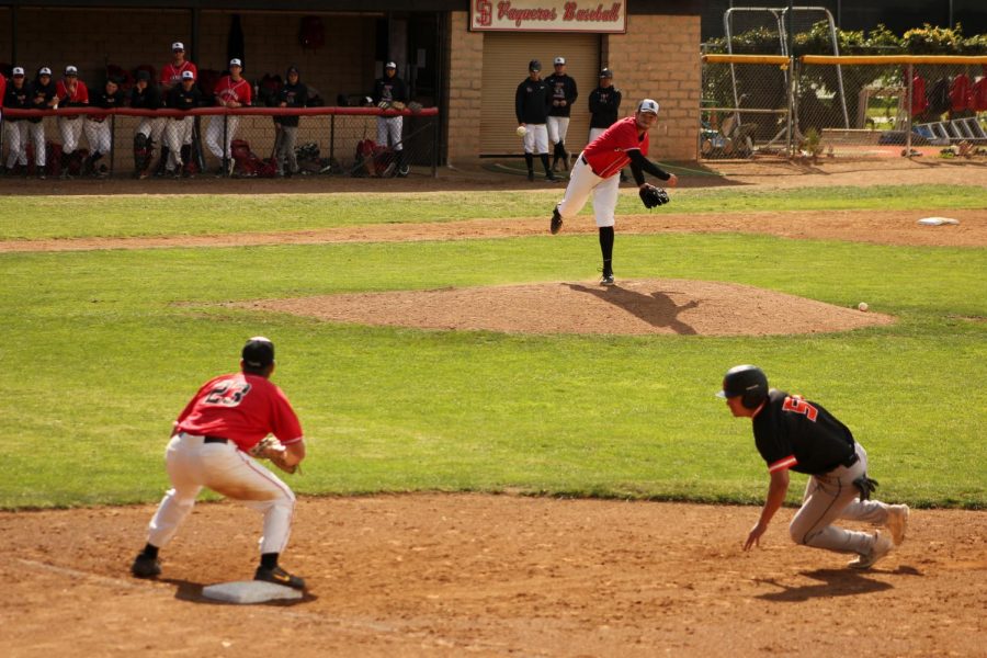 Pitcher Matthew Strother (no. 24) throws to first baseman Jacob Bravo (no. 23) in an attempt to catch Ventura’s Tommy Gibbons-Matsuyama (no. 5) stealing on March 7, 2020 at Pershing Park in Santa Barbara, Calif. Gibbons-Matsuyama was safe by a thin margin.