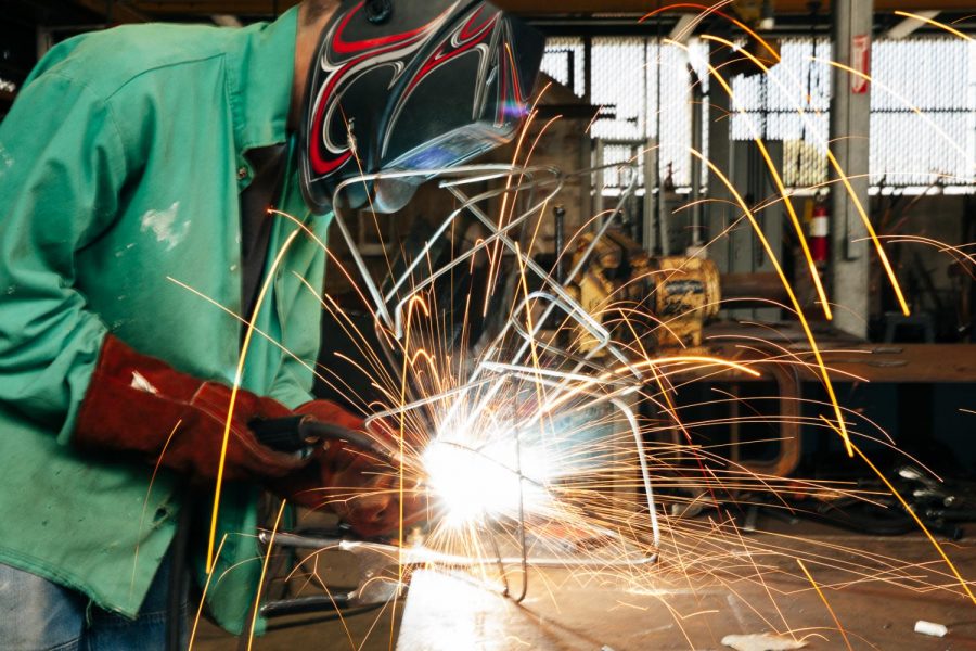 Will Laraway mig welds a small metal sculpture for a complex undefined objects project for his sculpture class on Friday, March 12, 2020, behind the Humanities Building at City College in Santa Barbara, Calif. Students in the class learn wood and metal shop skills to use with their projects.