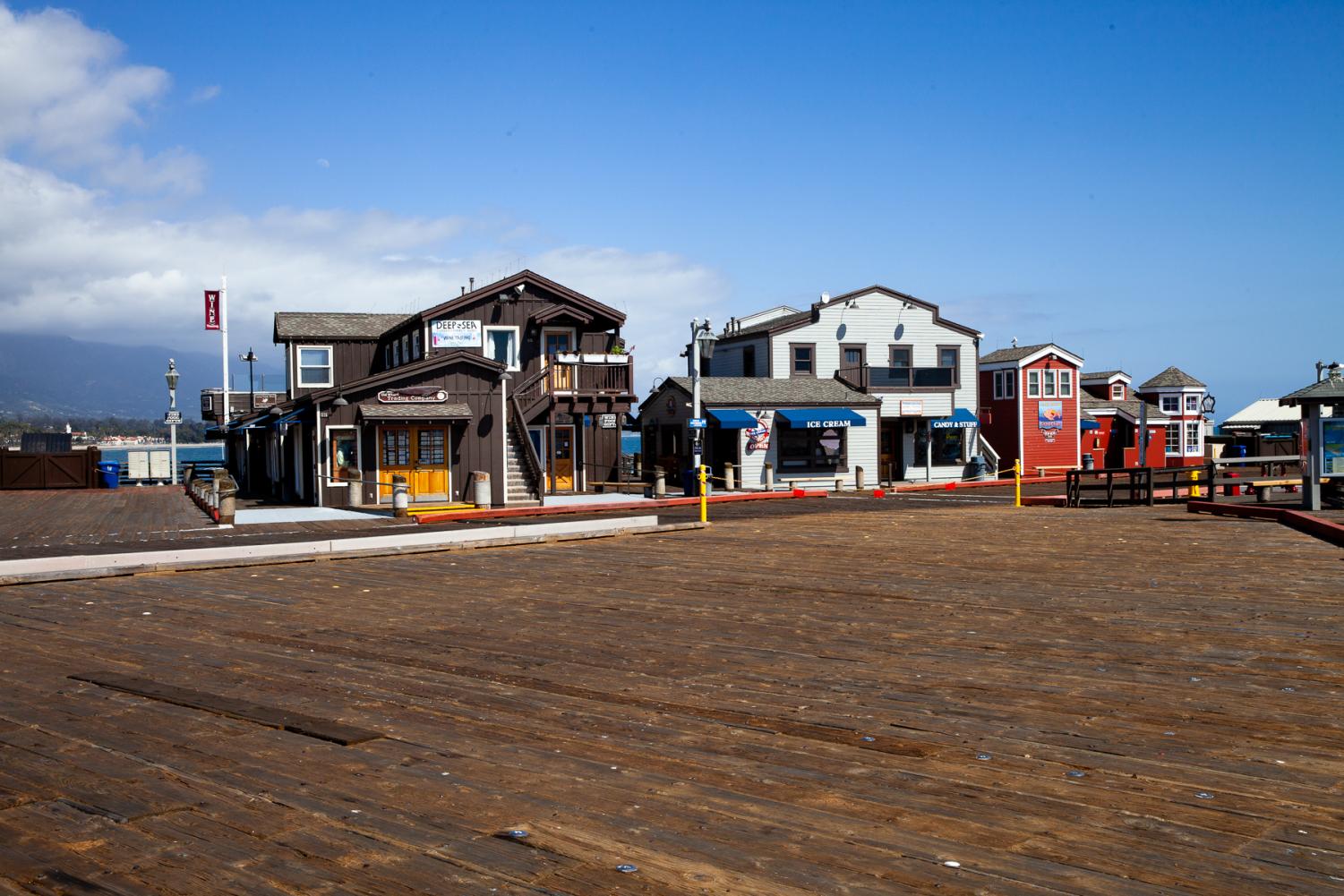 Restaurants and shops on Stearns Wharf remain open but see little traffic as shelter-in-place measures continue through April.