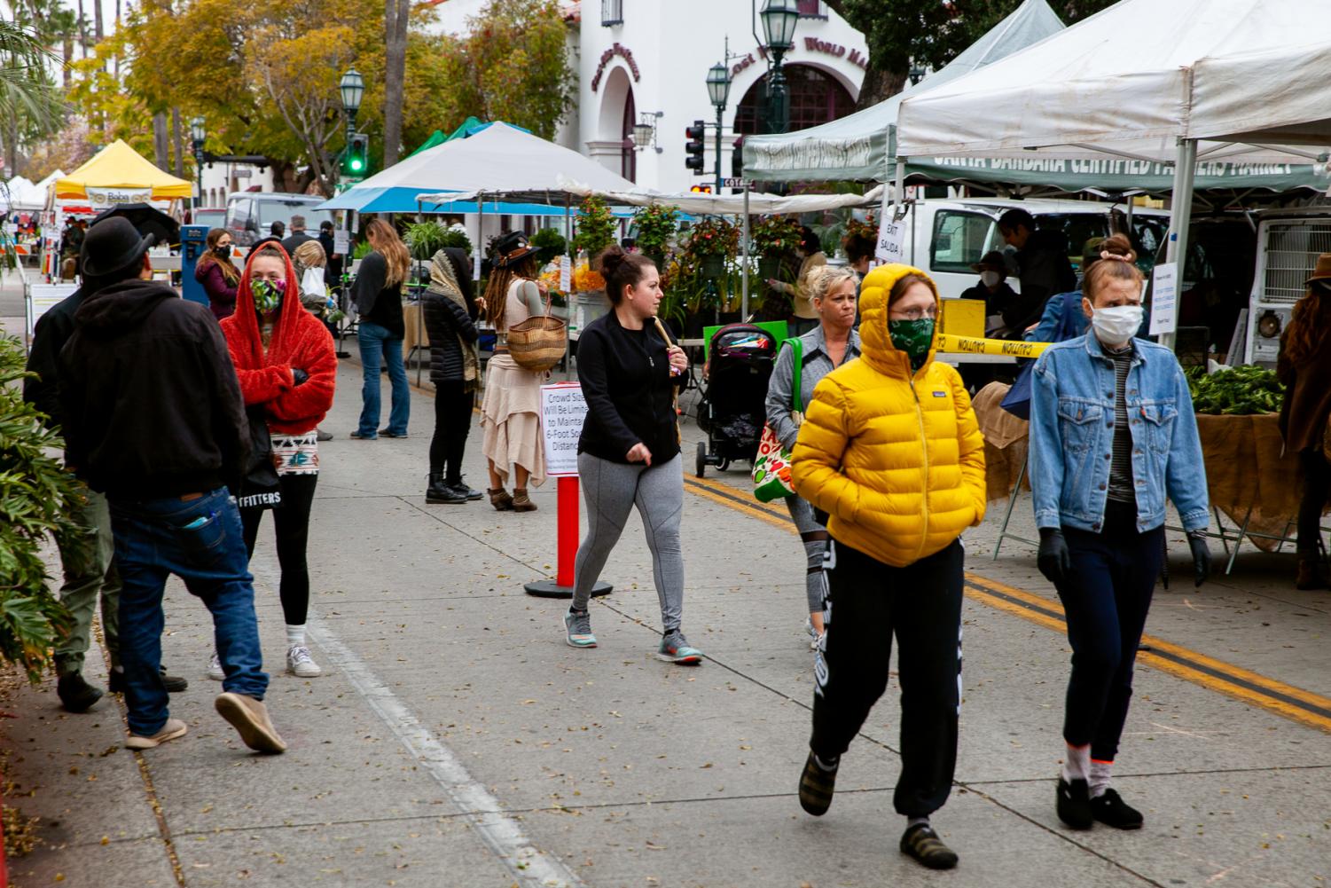 Community members attend the State Street Farmers Market on Tuesday, April 7, on Lower State Street in Downtown Santa Barbara, Calif. Hand sanitizer stations were staggered throughout the lineup of local produce.