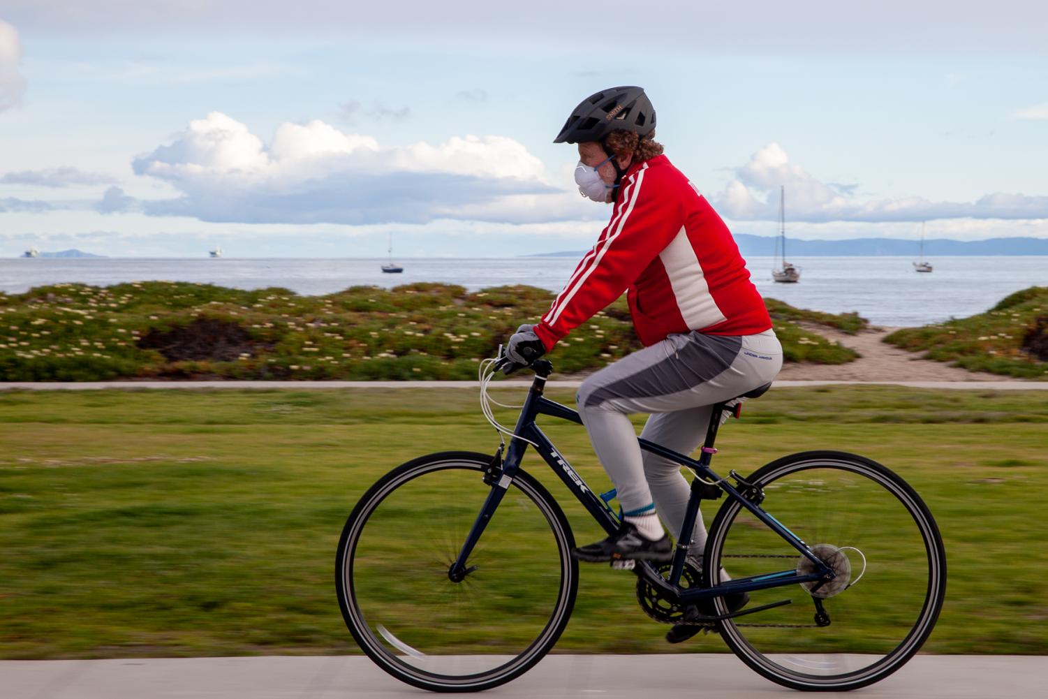  Cyclist Dermot Downs rides eastbound along E Cabrillo Boulevard on Wednesday, April 8, near East Beach in Santa Barbara, Calif. Downs thinks it’s positive that people are getting out of the house to exercise, as long as they stay safe. 