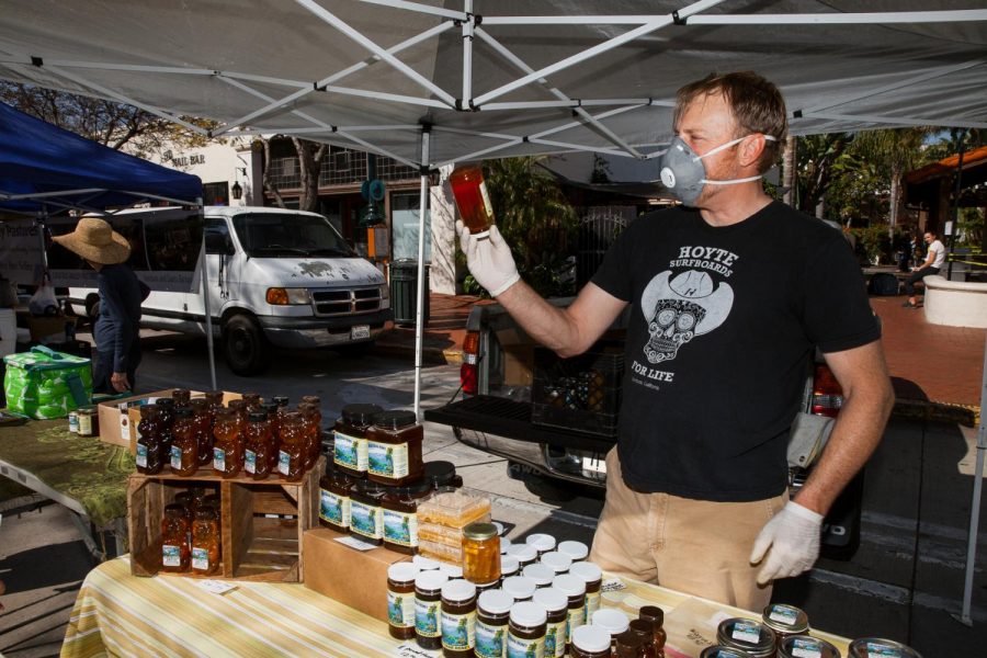 Owner of Blue Ridge Honey Greg Mitchell has seen sales go up as the local farmers market has remained open throughout the state-wide business closures on Tuesday April 21, 2020 in Downtown Santa Barbara, Calif.