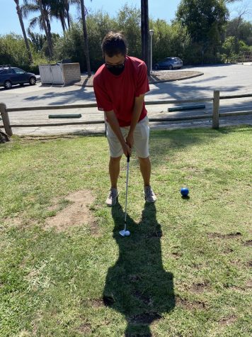Michael Koskin lines up his golf club with the ball at Twin Lakes Golf Course on Sept. 9, 2020 in Goleta, Calif.