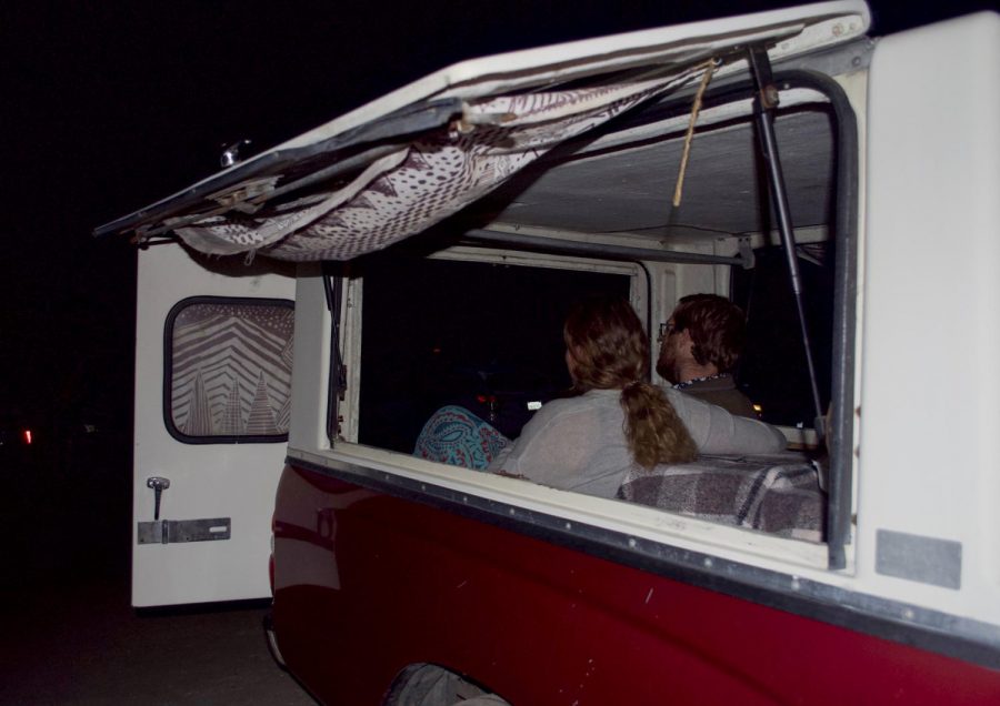A couple sits in the backseat of their car as they watch the screening of the Patagonia documentary