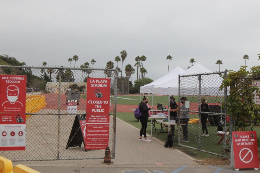 City College Student checks in before the first day of Physical Education classes on Monday, Aug. 31 at La Playa Stadium in Santa Barbara, Calif. All students and staff must complete a health survey before being allowed to participate in on-campus activities.