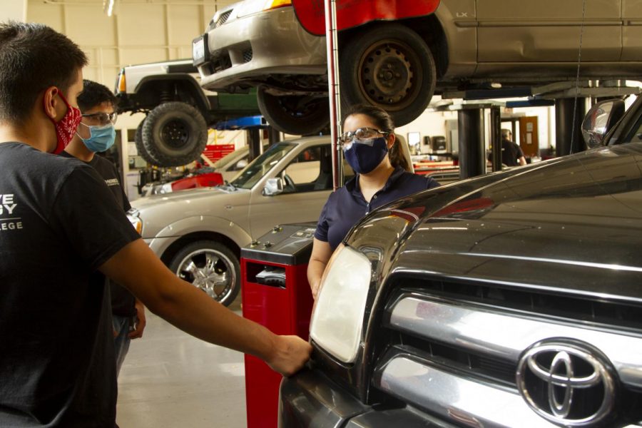 Instructor Brittanye Muschamp gives specific directions based on questions from Juan Carlos and Diego Espinoza on Oct. 8 at City College in Santa Barbara, Calif. Espinoza said that the in-class labs are “awesome” and followed it up with “we learn better this way.