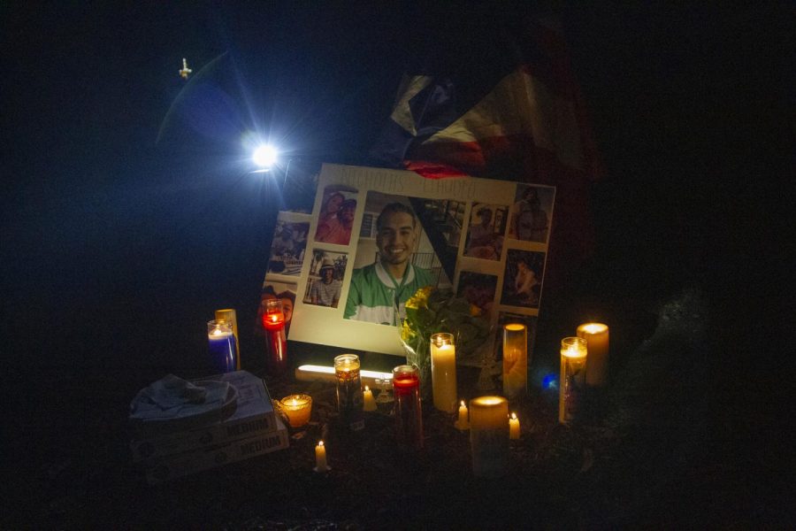 A memorial put together in Nicholas Claudios honor for his vigil on Oct. 3 at Sands Beach in Isla Vista, Calif. Claudios close friends placed items that reminded them of him like pizza, candles with messages written on them, flowers and alcohol.