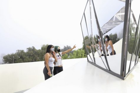 Arianna Sanchez (left), and Martha Newmeyer look over the small details of their newly completed sculpture for the Los Angeles based artist Muna Malik's installation "Blessing of the Boats" on Nov. 2, on the Atkinson Gallery sculpture terrace at City College, Calif. They have been working on the installation for six weeks and are excited to finally share it with the community.