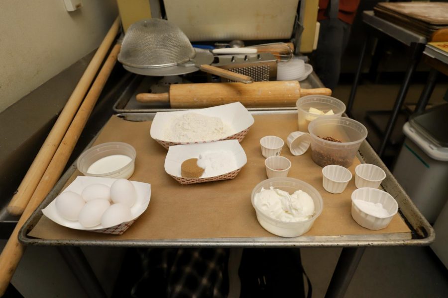 Before the new class structures that were put into place by the COVID-19 pandemic, the culinary classes would be taught in pods with shared equipment and ingredients; now each student has their own workstation, supplies and ingredients. Before each class the instructor and LTA’s prep each station with trays of supplies and ingredients measured out for their exact needs that day in class. 
